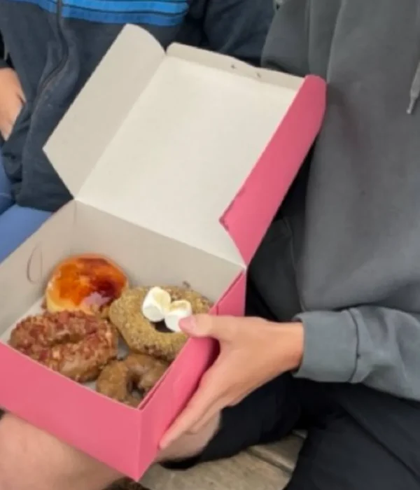 Fresh classic glazed and frosted donuts at Bob's Donut & Pastry Shop on a San Francisco tasting tour